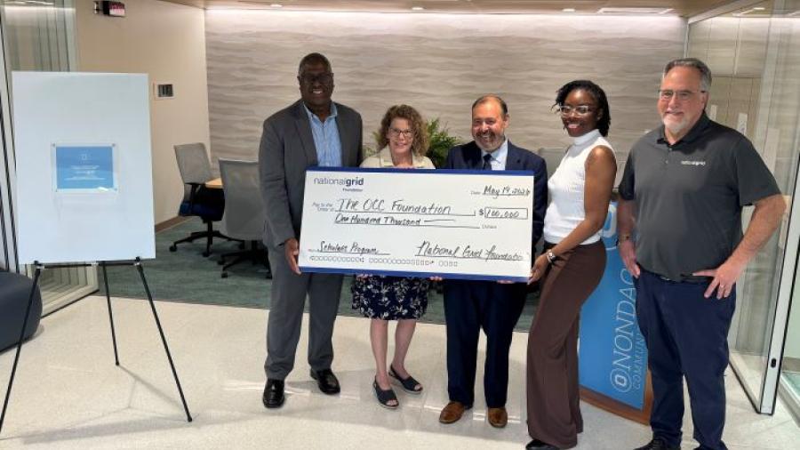 The National Grid Foundation's check presentation to Onondaga Community College included (left to right) OCC's Warren Hilton, Louis Noce, and Terry Hopkins, and National Grid's Kahri Fuller and Alberto Bianchetti.
