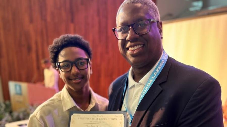 Daylen Tamarez (left) is congratulated by Onondaga Community College President Dr. Warren Hilton for completing the Sankofa Pre-College Summer Program. Tamarez came to OCC from New York City where he will be a high school junior this fall.
