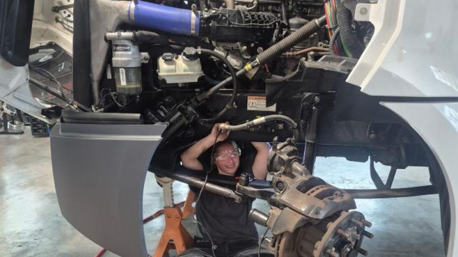 Alaina Kelsey is enjoying her hands-on learning opportunities in Onondaga Community College's new Commercial/Heavy Equipment Service Repair program. She's working on a 2023 Frieghtliner truck that was loaned to OCC by Tracey Road Equipment.