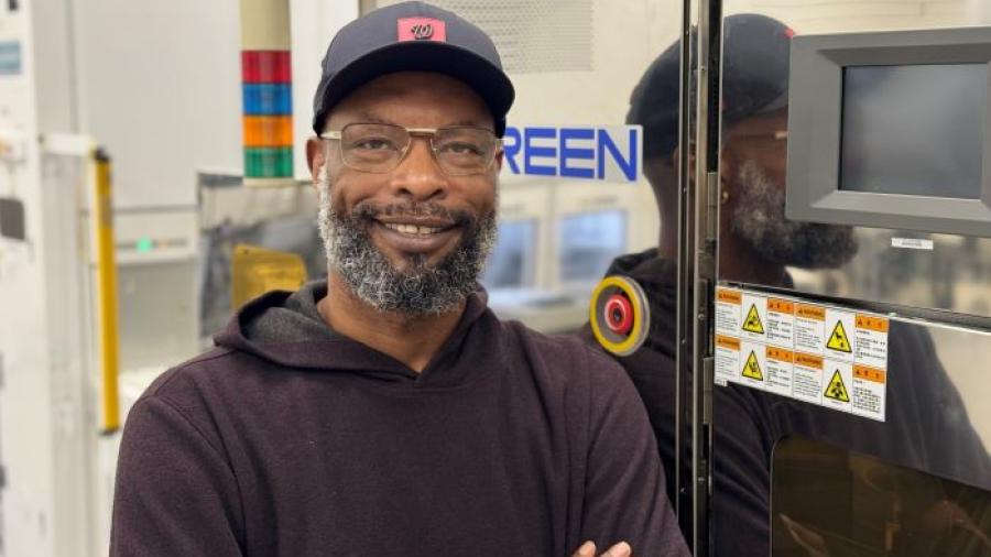 Greg Anderson is a 45-year-old student at Onondaga Community College who will complete his Electrical Technology degree this December, then go to work at Micron Technology in Virginia. He's pictured in the Micron Cleanroom Simulation Lab on the OCC campus.