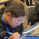 Students experimented with soldering at Micron-sponsored Chip Camp.