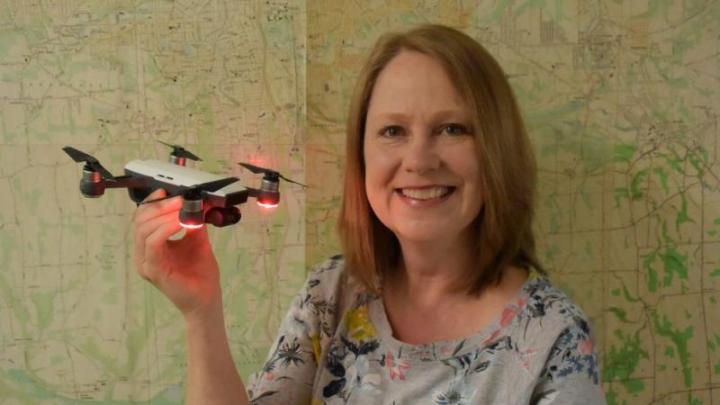 Photo of OCC Professor Buffy Quinn holding a drone