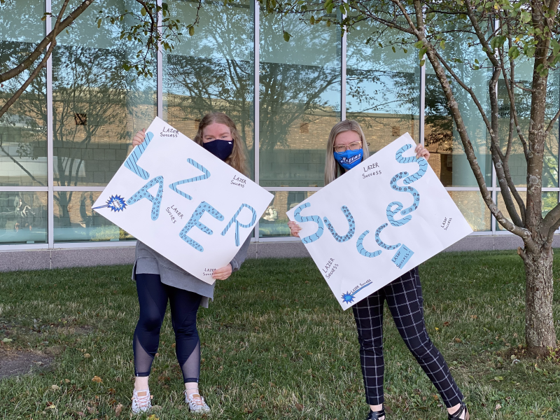 Student &amp; Employee with Lazer Success Signs