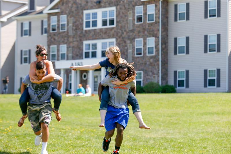 Students playing games by the res halls