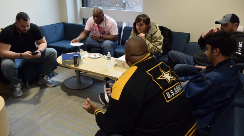 OCC Student Veterans enjoy free pizza and good conversation in the Office of Veterans and Military Services on Veterans Day.
