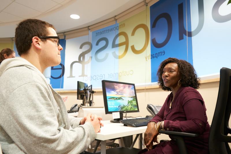 Student meeting with employee