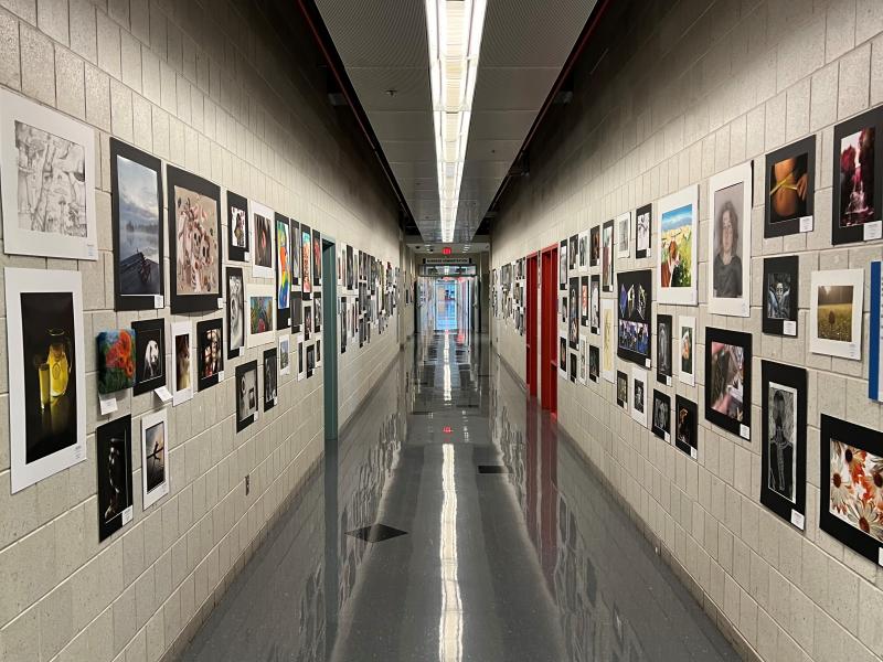 Award-winning work from the Scholastic Art Show lines the halls of the Whitney Applied Technology Center.
