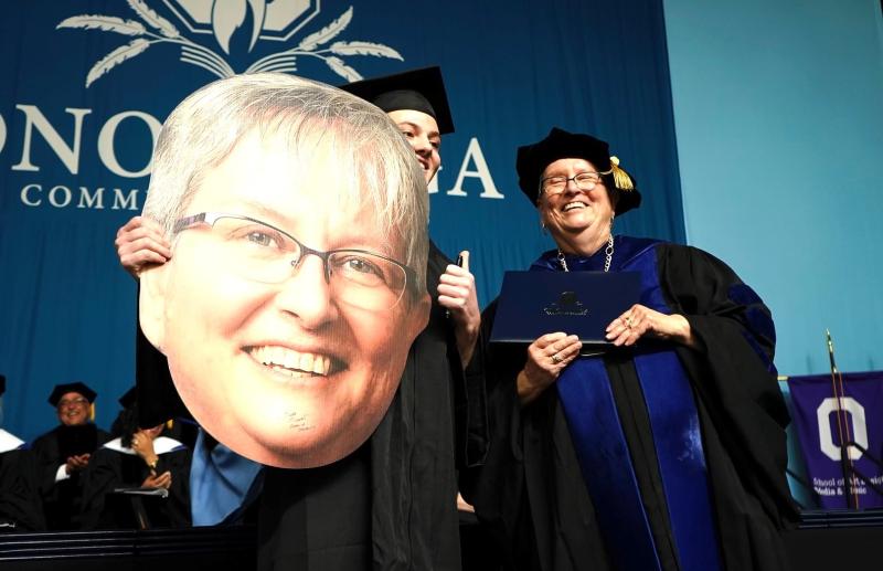 A graduating student brought his Dr. Casey Crabill on stage and had it autographed when he received his degree.