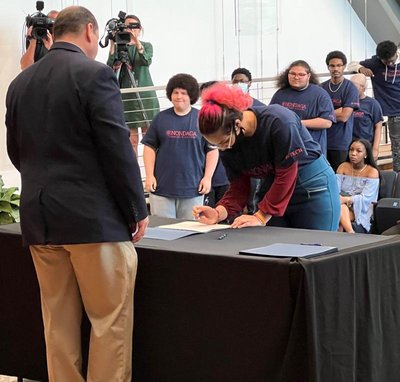 11th and 12th grade Syracuse City School District students signed up for the P-TECH program during a ceremony in the Frederick Marvin and Ernst Schuh Recital Hall.