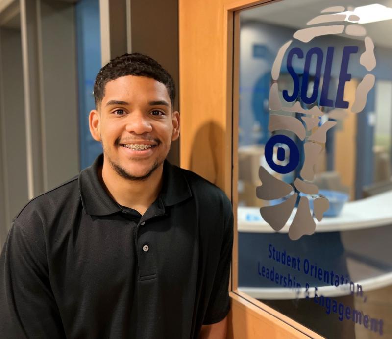 Chris Cedano Alcala is pictured outside the Student Government office on the first floor of the Gordon Student Center.