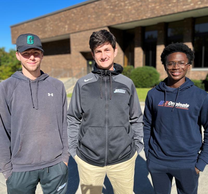 Men's Soccer Head Coach Mike Drake (center) and players Jack Hopson (left) and Thomas Nimineh (right) are pictured on campus. They joined us recently for an edition of our podcast, &quot;Chatting About College.&quot;