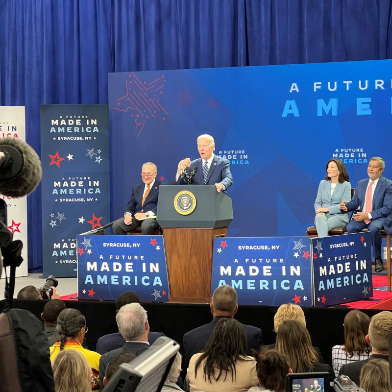 President Joe Biden speaks in OCC's Allyn Hall Gymnasium during a celebration of Micron's $100 billion dollar investment in the region.
