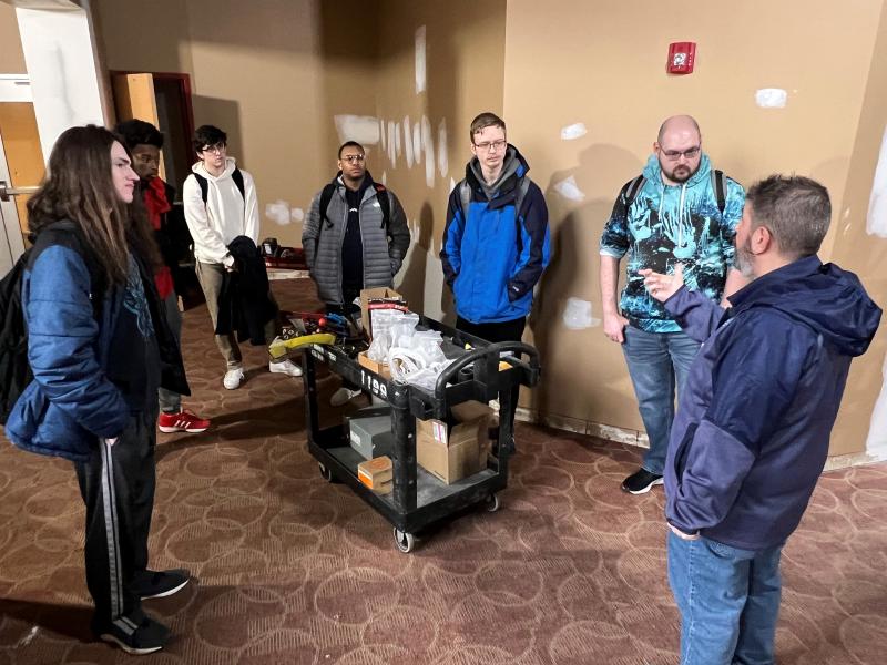 Esports Head Coach Keith Edwards (right) shows his Lazers student-athletes the space they will soon call home.