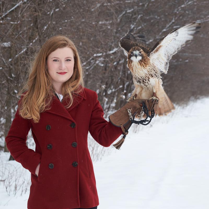 Dr. Mary Cope is pictured with her hawk in 2016 when she was a student at OCC. Today she is an Animal Nutritionist for BSM Partners.