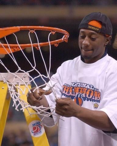 Tyrone Albright '02 cuts down the net following Syracuse University's victory in the 2003 NCAA National Championship Game. (photo courtesy Tyrone Albright)