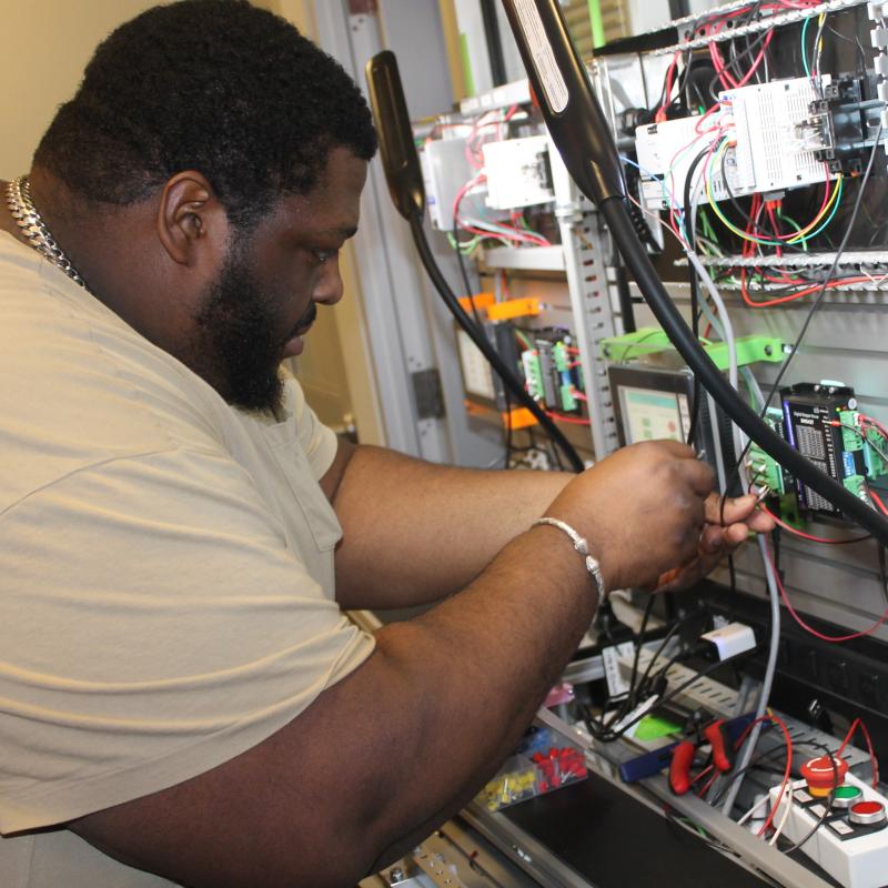 Turage Stephenson works in Onondaga Community College's Electromechanical Lab as part of the Syracuse Surge's Advanced Manufacturing Program.