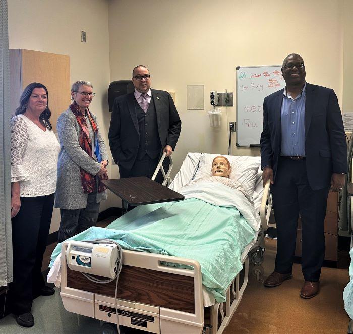 Touring OCC's simulated patient lab in Ferrante Hall are (left to right) OCC Dean Dr. Karen Fabrizio, State Senator Rachel May, State Senator Gustavo Rivera, and OCC President Dr. Warren Hilton.