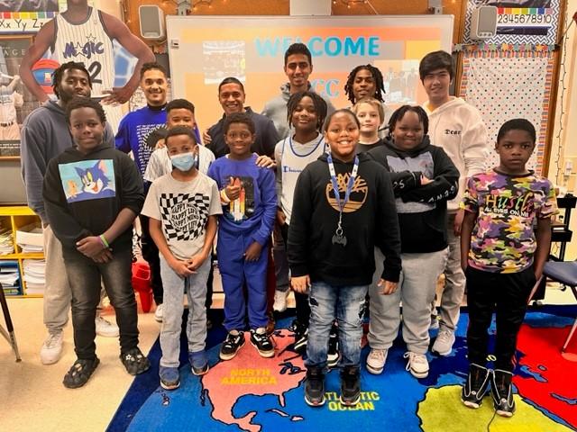 Bringing the students together are (back row left to right) Isiah Duggar and Cameron Littlejohn '15 of Meachem Elementary, and OCC's Shayne Turo '23, Jaedin Roget-Feimster, Mustafa Alnuaimi, and Sharif Jafari.