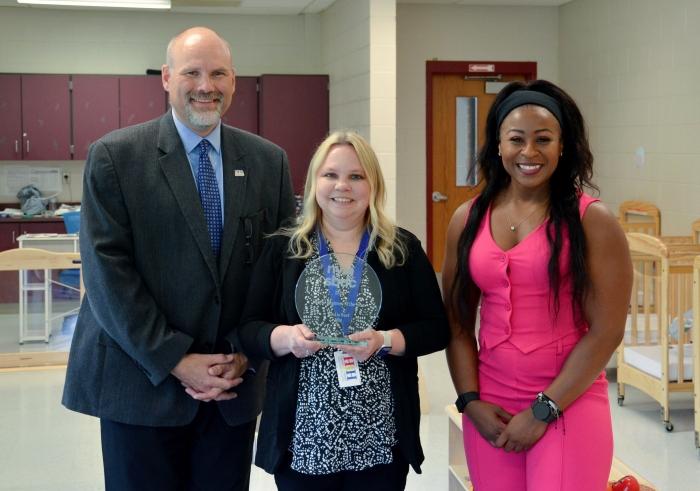 Jenniffer Bleakley of Hand In Hand Child Care Center (middle) received the 2024 New York Small Business of the Year Award from Onondaga SBDC Regional Director Robert Griffin (left) and New York State SBDC Director Sonya Smith (right).