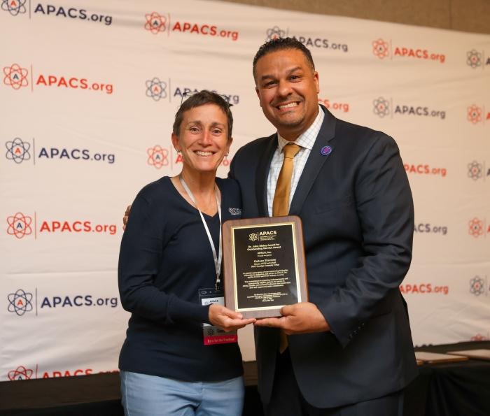 Onondaga Community College's Colleen Stevens (left) receives the Dr. John Staley Award for Outstanding Service from Renaldo D. Alba, Ed.D., President of the Association for Program Administrators of CSTEP and STEP, APACS, Inc.