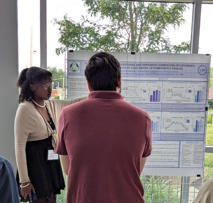 Balqiisa J-Elmi (left) presents the findings of her research conducted through the Bridges to Baccalaureate program. The PSLA at Fowler High School graduate just transferred from OCC to SUNY Binghamton where she is beginning her first semester.
