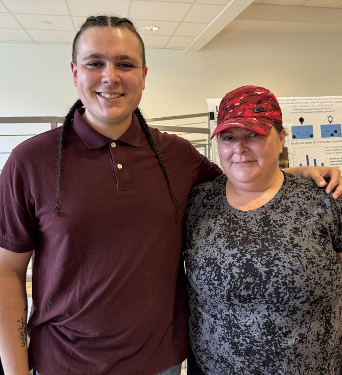 OCC student Dustin Klock (left) invited his mom, Zoann Thompson (right), to watch him present the findings of his summer research at SUNY-ESF. &quot;I'm amazed by what he did,&quot; said Thompson.