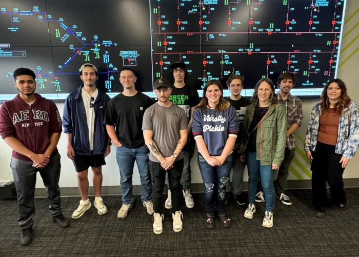 Students in Professor Betsy Nicholas's Power Systems I class visited the National Grid Power Distribution Control Center in Liverpool. They are pictured in the Training Center there.