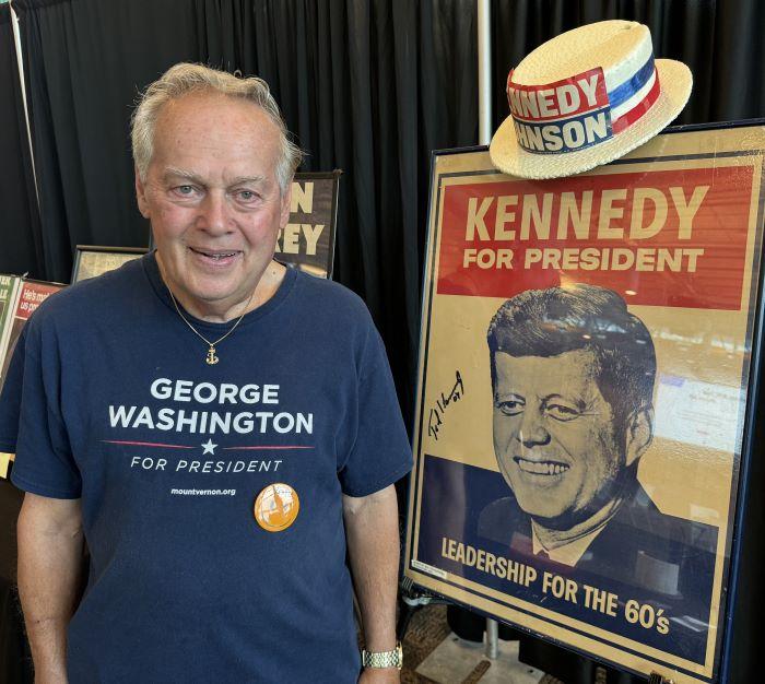 Retired OCC Professor Dick Woodworth brought his political memorabilia collection to campus. He's pictured with the first item he ever collected, a poster promoting John F. Kennedy for President. Woodworth had the poster signed by Kennedy's younger brother, U.S. Senator Ted Kennedy.
