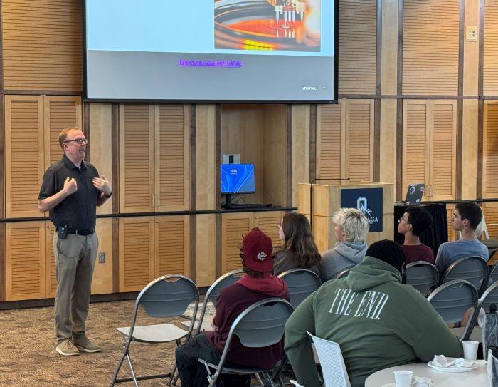 Micron's Mike Guttman speaks with students about paid summer internship opportunities. Approximately 65 students attended the information session.