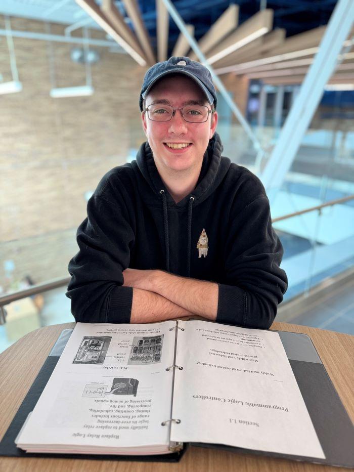 Mitchell Cook is a 29-year-old student in the Electromechanical Technology degree program. He's attending Onondaga Community College debt-free thanks to the SUNY Reconnect program.