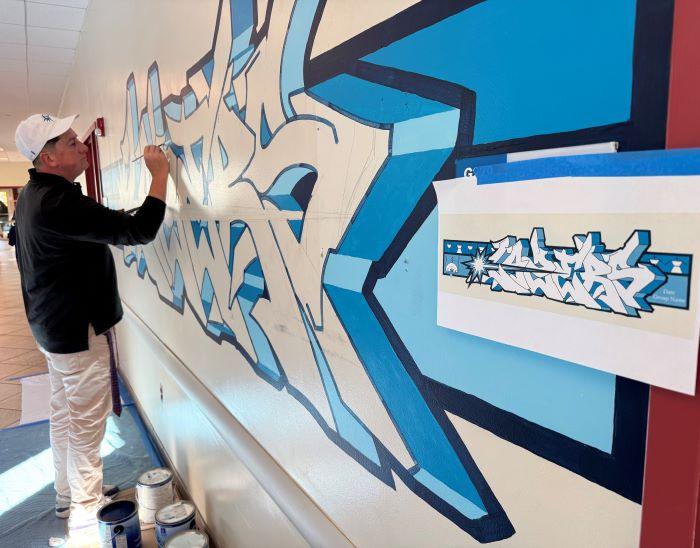 Brandon Lazore'14 designed and painted a &quot;Lazers&quot; logo in the main hallway of the Gordon Student Center.