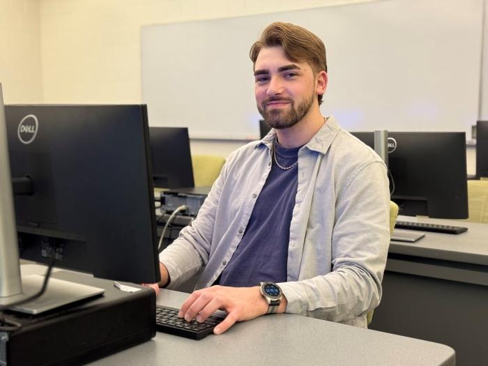 Carter Menikheim is a 26-year-old student in the Computer Information Systems degree program. He's attending OCC tuition-free thanks to the SUNY Reconnect program.