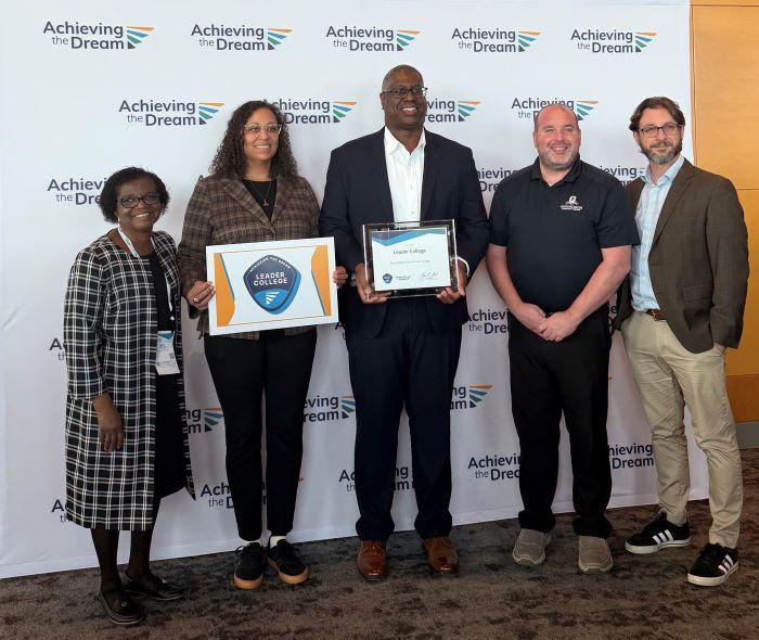 Accepting OCC's designation as an Achieving The Dream Leader College are (left to right) Agatha Awuah, Naomi Stewart, Warren Hilton, Ted Mathews, and Matt DelConte.