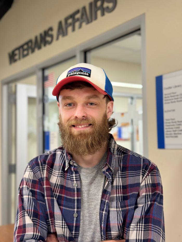 Eric Kreisler is a 33-year-old Student Veteran who will complete his Electrical Technology degree this semester. He's pictured outside OCC's Office of Veterans and Military Services on the second floor of Coulter Hall.