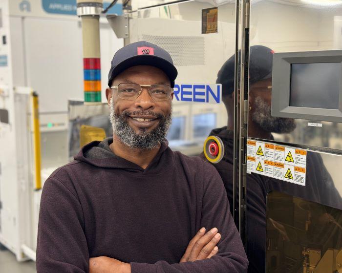 Greg Anderson is a 45-year-old student at Onondaga Community College who will complete his Electrical Technology degree this December, then go to work at Micron Technology in Virginia. He's pictured in the Micron Cleanroom Simulation Lab on the OCC campus.
