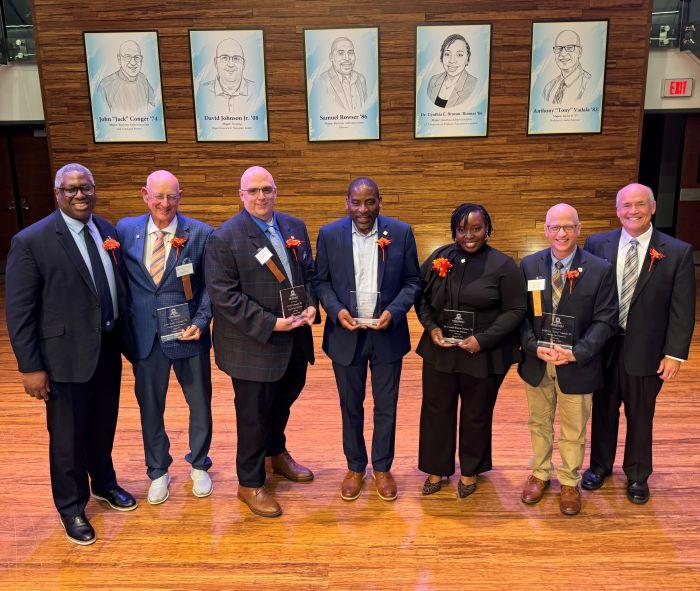 Left to right: OCC President Warren Hilton, honorees Jack Conger, David Johnson Jr., Sam Rowser, Dr. Cynthia E. Bruton-Thomas, Anthony Vadala, and emcee Glenn LaPoint.