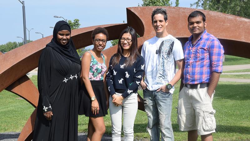 Summer scholarship recipients include (left to right): Deynaba Farah, Ashley Claris, Tam Nguyen, Raul Ceballos and Ghan Timsina.  Claris received the Learn As You Grow Summer Scholarship, the others received the National Grid Summer Incentive Scholarship.