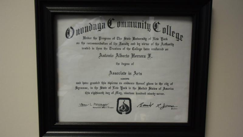 Herrara's OCC degree hangs on the wall behind his desk at Syracuse's Martin Luther King School.