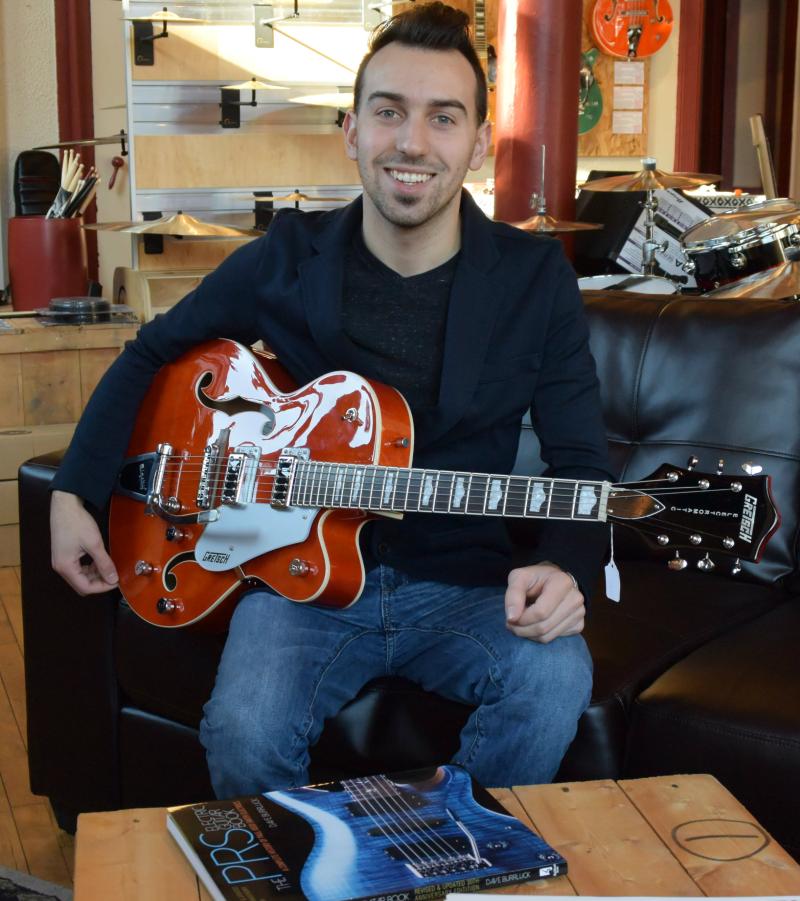 On couch with guitar