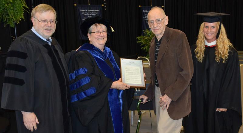 Paying tribute to Philip G. Klein for creating the College's Alma Mater are (left to right) Music Professor Dr. David Abrams, OCC President Dr. David Abrams, Klein and his daughter Amy Klein who is a Professor in the Department of Health, Physical Education and Recreation.