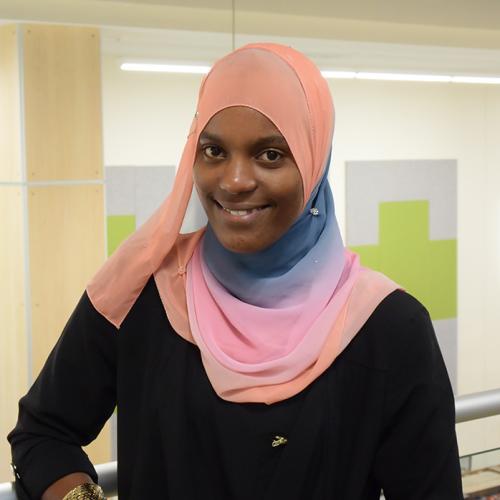 Hassina Adams, Honors Program alumna, Syracuse University graduate, and OCC Alumni Faces honoree.