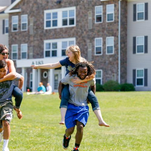 Students playing games by the res halls