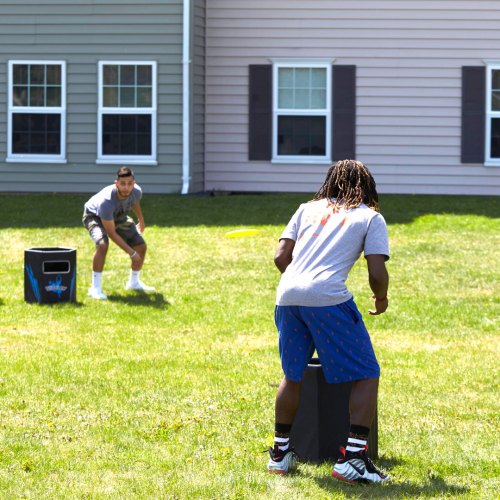 Students playing can-jam by the res halls