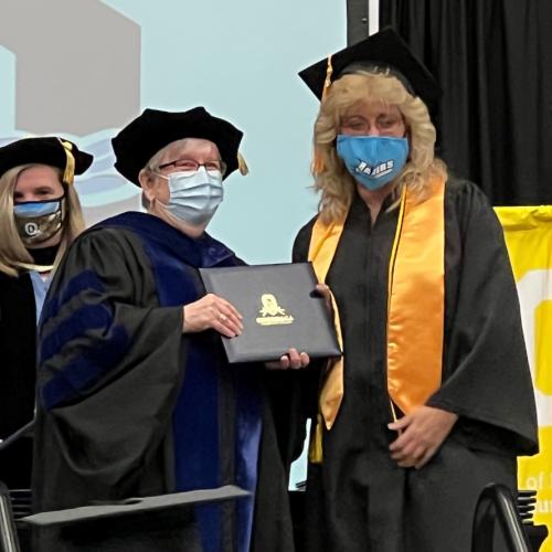 Kim Benton receives her degree