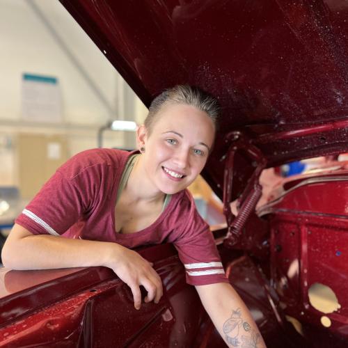 Claire Sears will complete her Automotive Technology degree in May. She's pictured in the Automotive Technology lab working on the 57 Chevy pickup truck students are restoring.