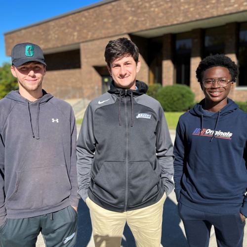 Men's Soccer Head Coach Mike Drake (center) and players Jack Hopson (left) and Thomas Nimineh (right) are pictured on campus. They joined us recently for an edition of our podcast, "Chatting About College."