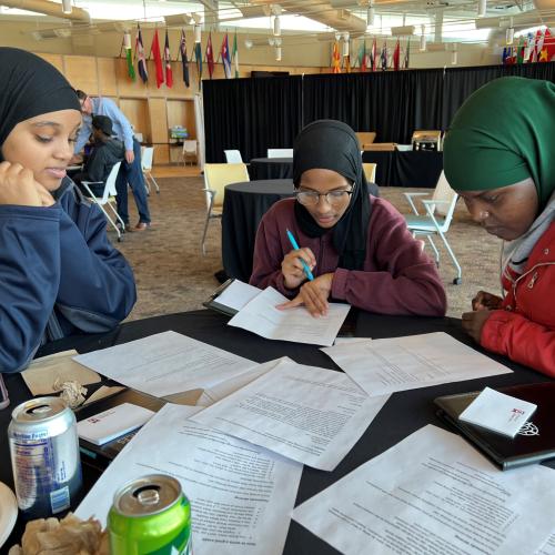 Onondaga Community College students (left to right) Hodan Ali, Istarlin Dafe, and Salado Mohamad discussed how to improve their writing skills during a workshop funded by the Robertson Endowment for Student Success in Writing.