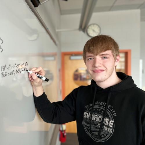 Maximus Wunderlich works on a calculus equation in the Whitney Applied Technology Center. He's a 12th grader in Spartan Academy who will complete his Mathematics & Science degree this semester.