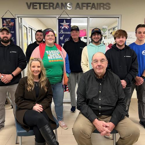 Leading OCC's Office of Veterans and Military Services are (front row) Technical Assistant Erin Elliott and Director Steve White. Behind them are Student Veterans who regularly come to the office on the second floor of Coulter Hall.