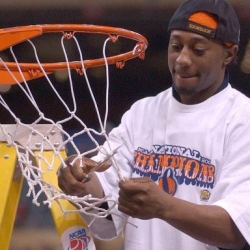 Tyrone Albright '02 cuts down the net following Syracuse University's victory in the 2003 NCAA National Championship Game. (photo courtesy Tyrone Albright)